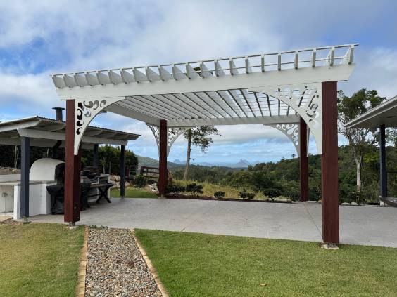 Completed custom alloy patio with decorative brackets and louvred roof