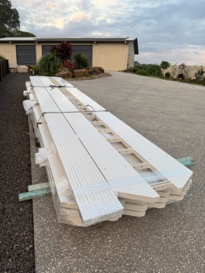 Powder-coated alloy patio components bundled and ready for install