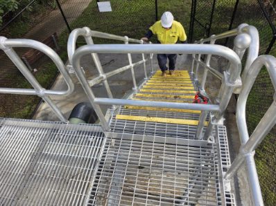 Galvanised access platform and stair with handrails at a water treatment site