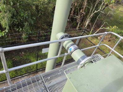 Handrail and pipework detail on an elevated steel platform